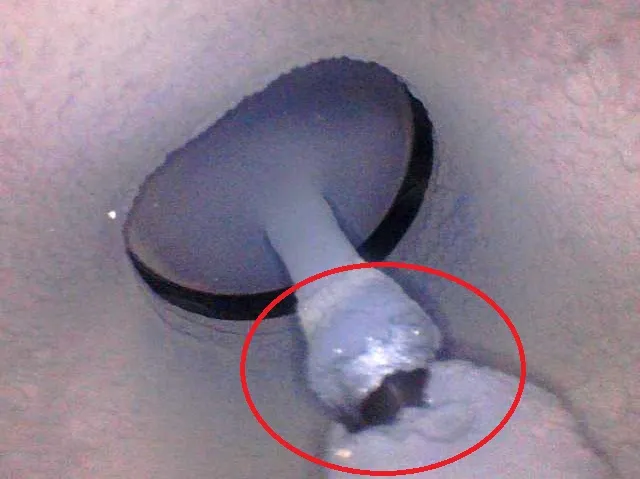 Intake valve cover with carbon deposits